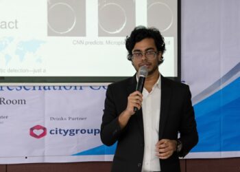 Adnan presenting at a conference