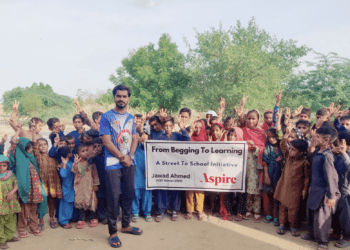 Jawad Ahmed standing with children